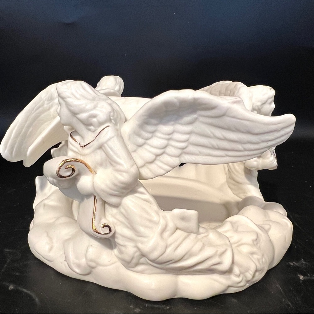 Vintage Christmas decor.  Trio of angels around a candle holder w/ Instruments